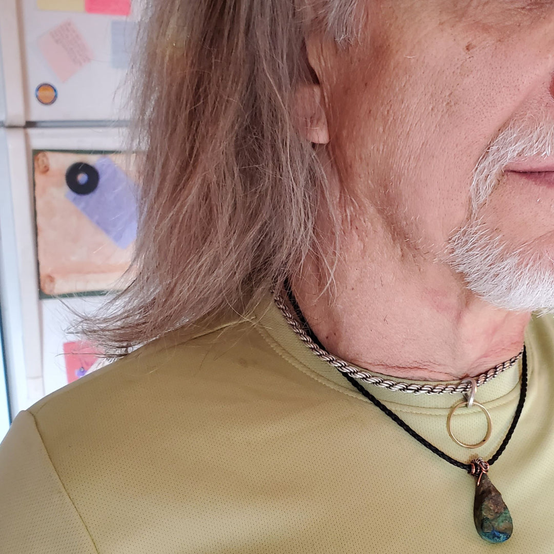 Older man wearing Wire_Wrapped_Natural_Cut_Azurite_Malachite_Drop_Necklace
