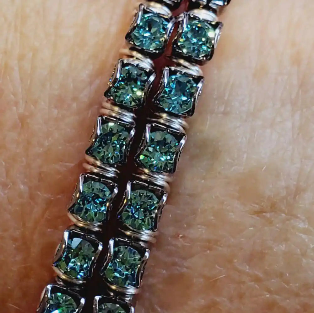 Wire Wrapped Turquoise Crystal Tennis Bangle Bracelet featuring stunning aqua blue Swarovski-quality crystals.