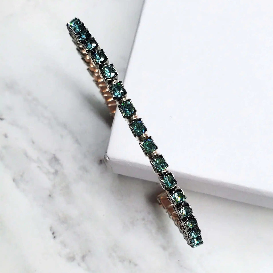 Wire Wrapped Turquoise Crystal Tennis Bangle Bracelet with aqua blue crystals on a hammered copper bangle.
