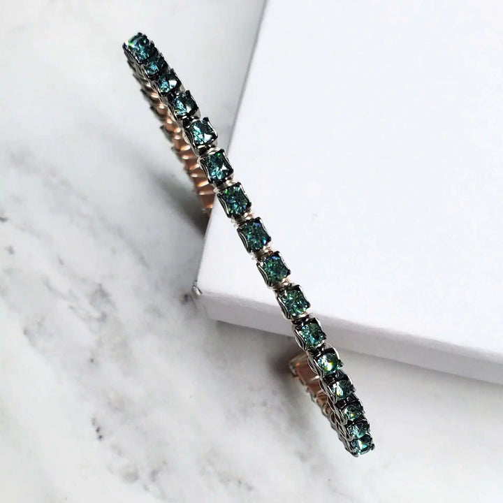 Wire Wrapped Turquoise Crystal Tennis Bangle Bracelet with aqua blue crystals on a hammered copper bangle.