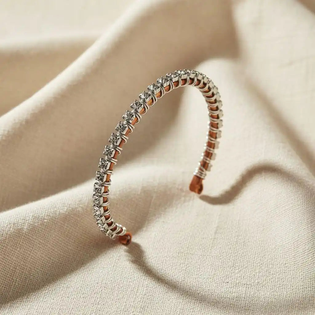 Catch-Free Crystal Rhinestone Tennis Bracelet Bangle showcasing clear Swarovski-quality rhinestone crystals on a hammered copper bangle.