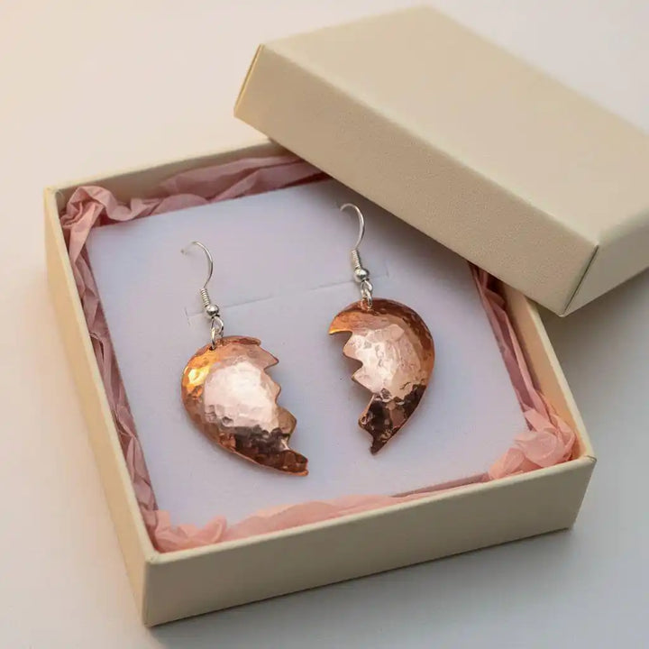 Handmade Sculpted Copper Broken Heart Earrings in a gift box with pink tissue paper.