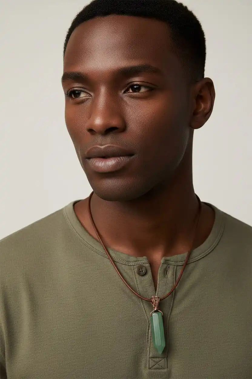 Handmade Rustic Wire Wrapped Gemstone Leather Necklace worn by a man featuring a pointed green crystal on leather cord.