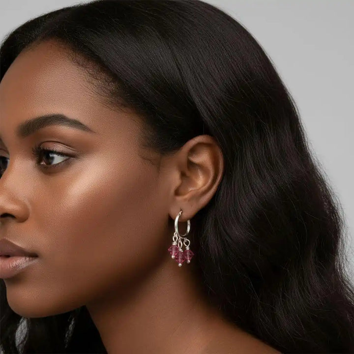 Model wearing Mini Sterling Silver Hoop Pink Crystal Dangle Earrings showcasing elegant design and sparkly pink crystals.