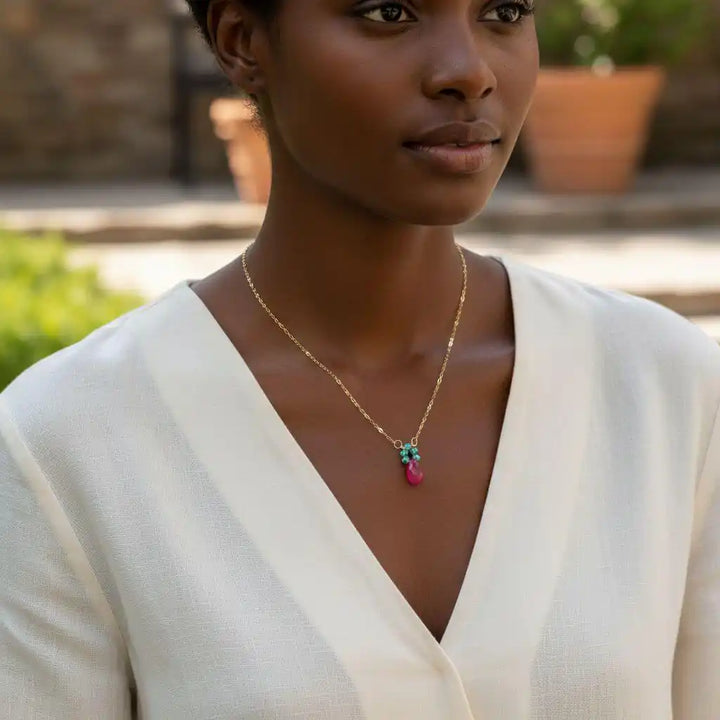 Gold Filled Pink and Aqua Gemstone Crystal Chain Necklace worn by model in stylish outfit outdoors.
