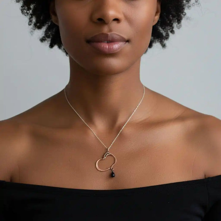 Hammered Copper Butterfly Wing Child Abuse Survivor Necklace worn by a model showcasing its elegance and unique design.