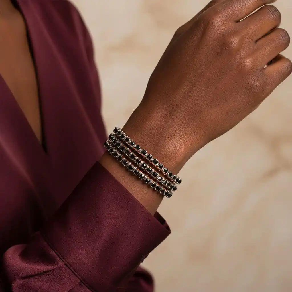 Wire Wrapped Copper Silver Black Crystal Rhinestone Bangle worn on a hand showcasing its elegance.