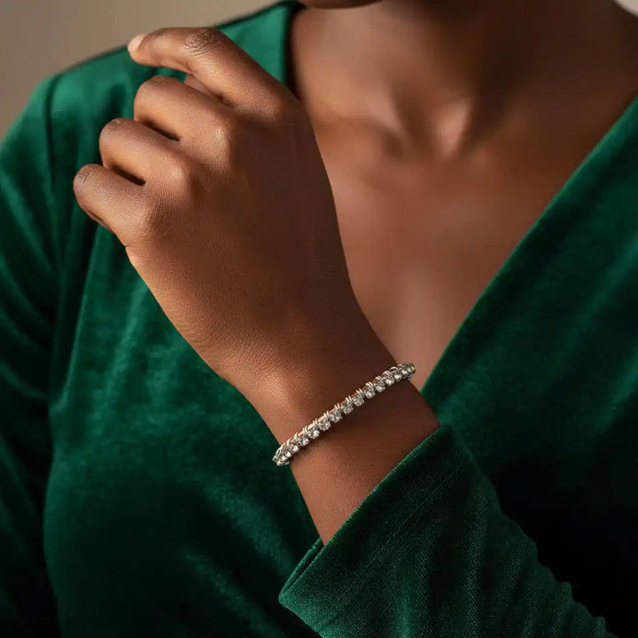 Catch-Free Crystal Rhinestone Tennis Bracelet Bangle worn on a stylish hand, complementing a green velvet dress.