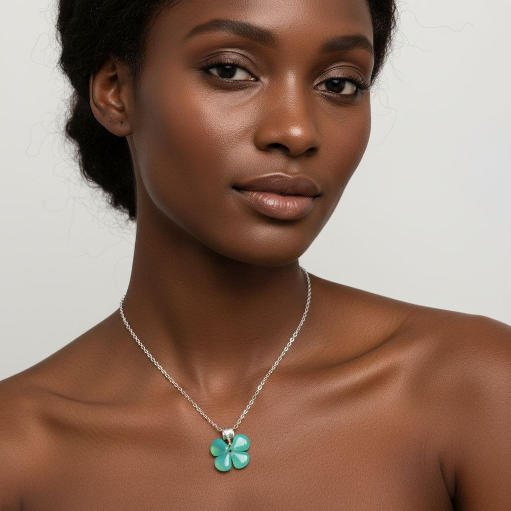 Model wearing a mint green beaded clover necklace with a silver chain, showcasing a stylish and elegant look.