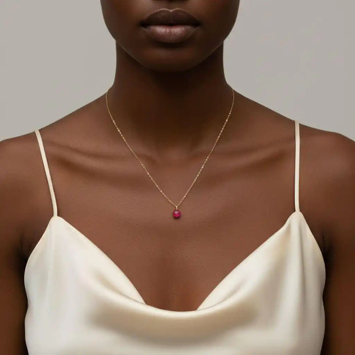 Tiny Hot Pink Chalcedony Gold Filled Necklace worn by a model, showcasing a vibrant pink drop on a delicate chain.