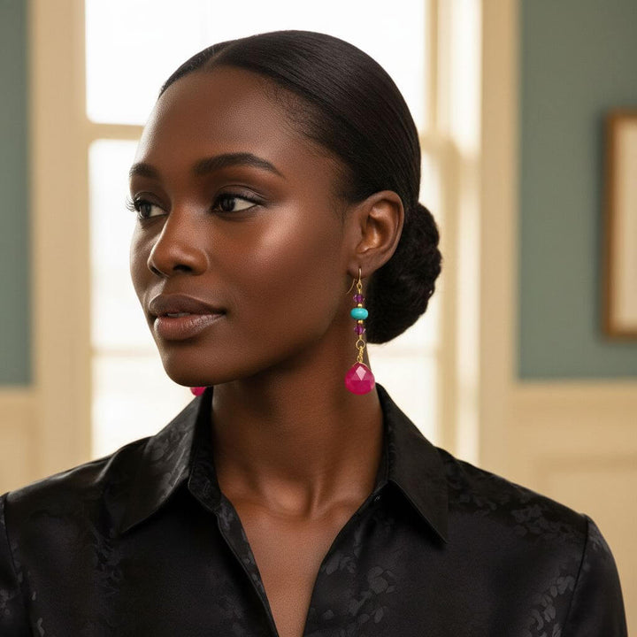 Gold Filled Wire Wrapped Pink Turquoise Gemstone Earrings worn by a model with a sleek hairstyle.