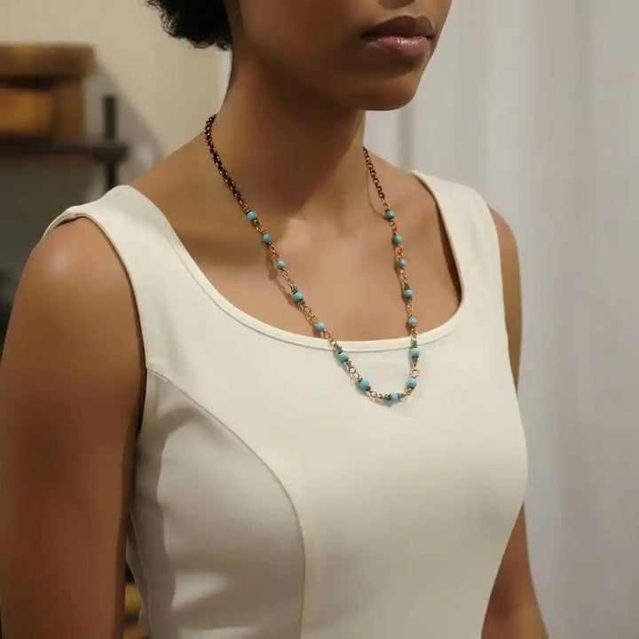 Model wearing a Wire Wrapped 24 Inches Copper Turquoise Necklace showcasing turquoise and copper details.