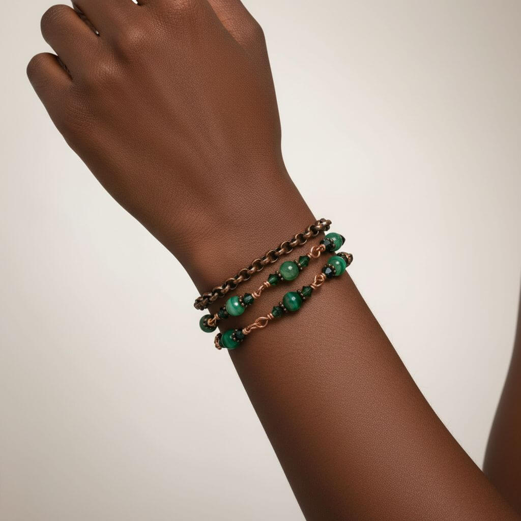 Hand wearing a 24 inches emerald agate wire wrapped necklace shown as a triple wrap bracelet with emerald-striped agate.