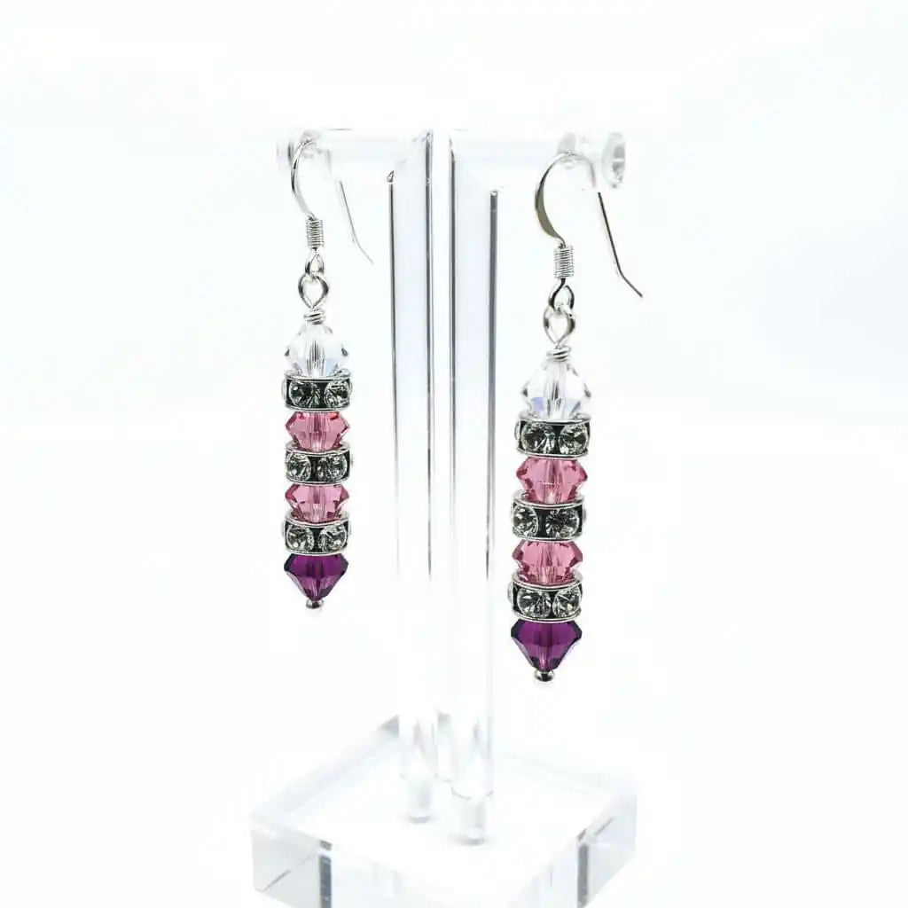 Hot Pink Ombre Stacked Crystal Sterling Silver Earrings displayed beautifully on a clear earring stand.