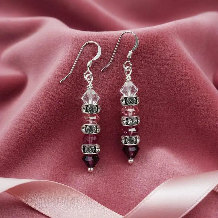 Hot Pink Ombre Stacked Crystal Sterling Silver Earrings on soft pink fabric background.