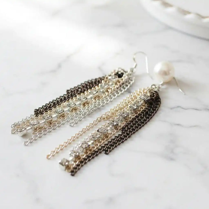 Rhinestone Crystal Chain Fringe Earrings featuring cascading light rose and mocha chains with sparkling rhinestones.