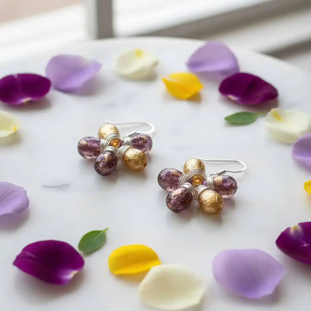 Purple and Yellow Flower Sterling Silver Earrings displayed with flower petals on a marble surface.