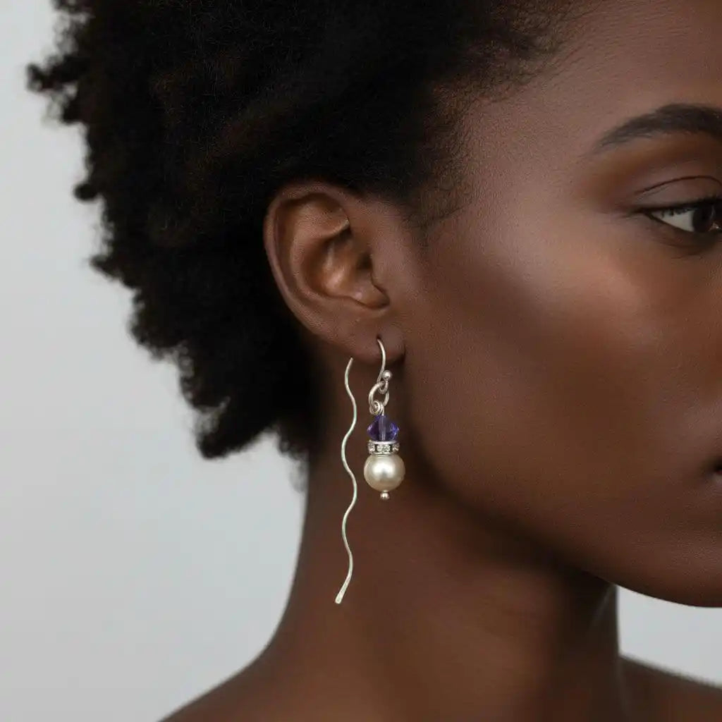 Innovative 925 Silver Swarovski Crystal Pearl Ear Threaders worn by a woman, showcasing unique design and elegance.