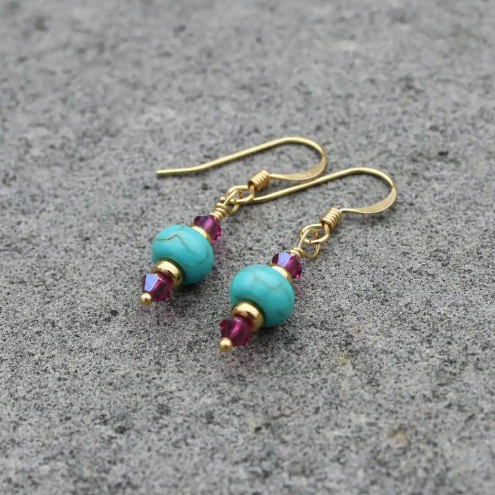 Hot Pink and Turquoise Gemstone14 K Gold Filled Earrings showcasing vibrant turquoise and pink Swarovski crystals.