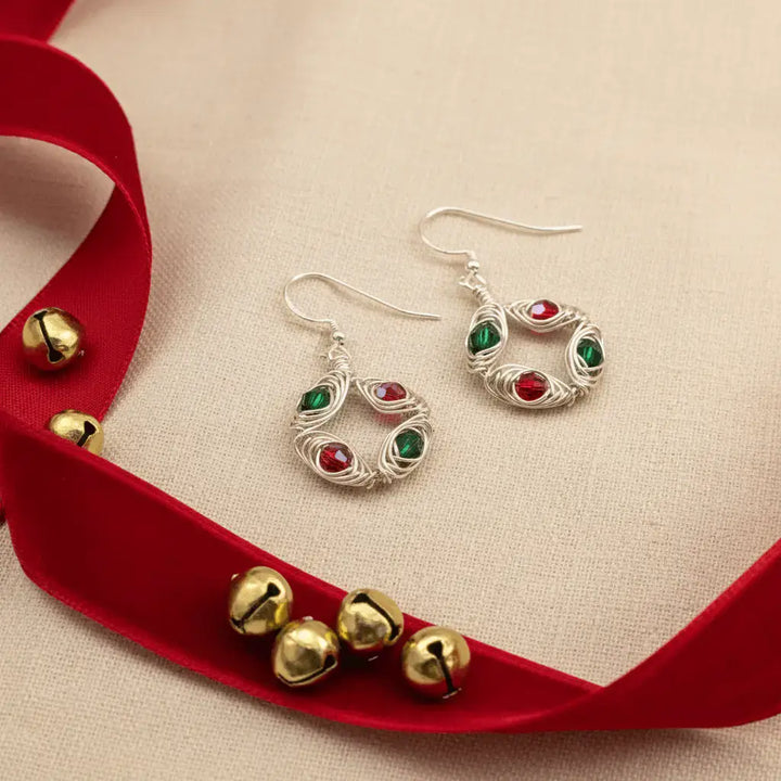 Christmas wreath earrings on linen with red velvet ribbon