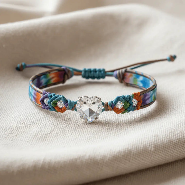 Tie-dye macrame leather bracelet on cream linen fabric