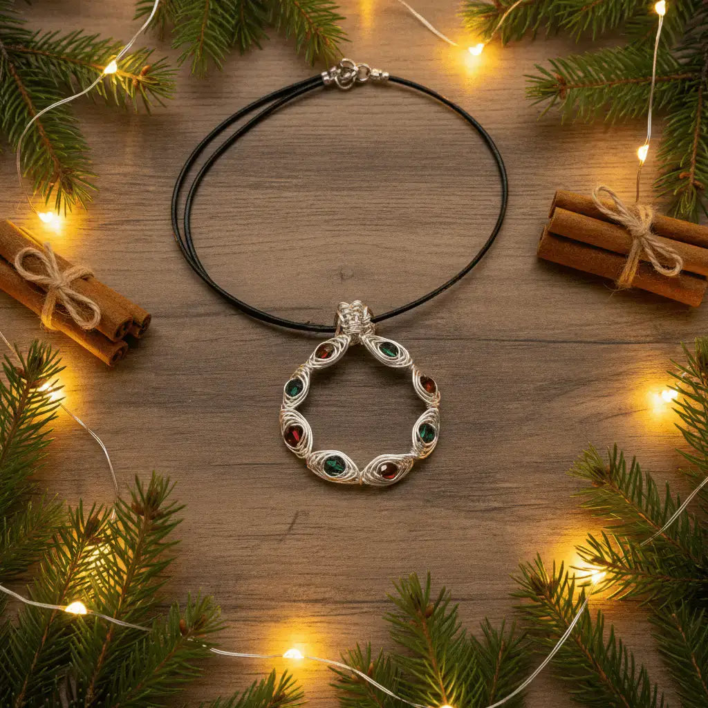 Christmas wreath necklace on wood with evergreen and fairy lights