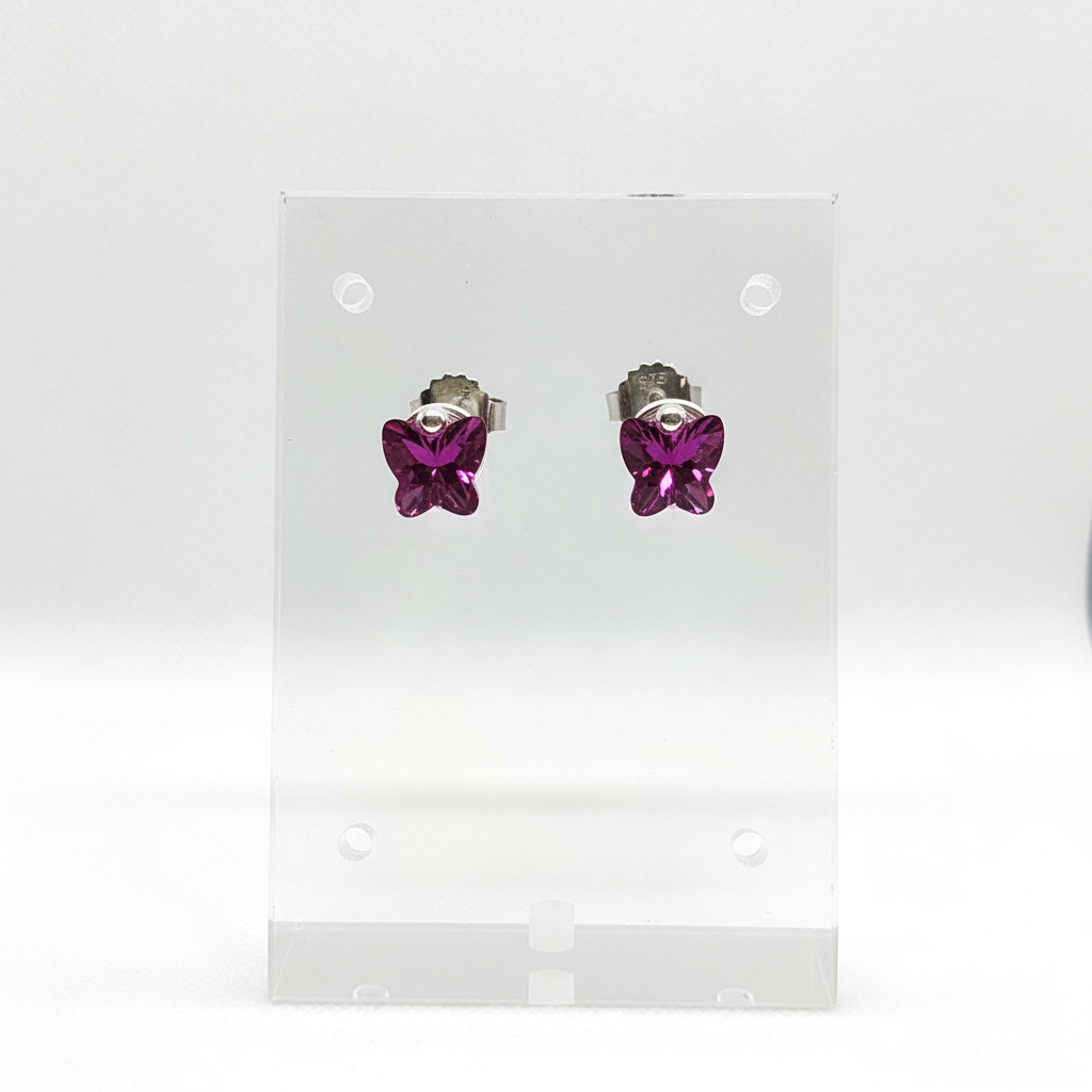 Butterfly studs on clear acrylic stand