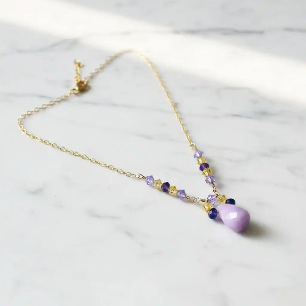 Lavender Candy Jade Drop Gold Wire Wrapped Necklace with lavender and purple Swarovski crystals on a gold chain.