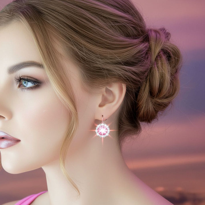 Close-up of a woman wearing Handmade Beaded Bezel Pink Crystal Halo Earrings featuring a Swarovski crystal.