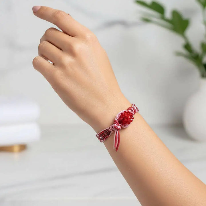 Leather Silk Bead Woven Crystal Button Bracelet displayed on a hand, showcasing its vibrant colors and intricate design.