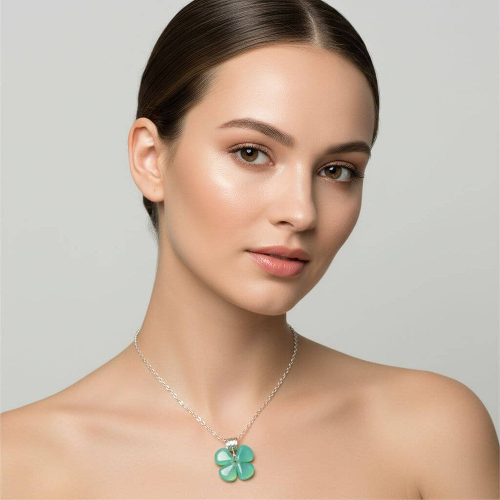 Mint green beaded clover necklace worn by a model, showcasing its modern and whimsical design.