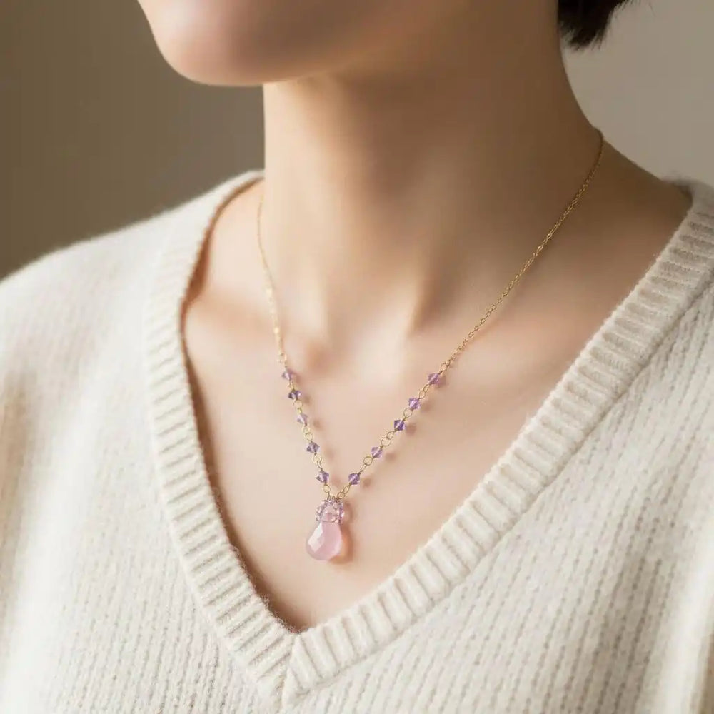Purple Chalcedony Drop 14 KT Gold Filled Gemstone Necklace worn by a model, showcasing lavender chalcedony and Swarovski crystals.