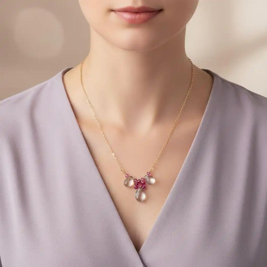 Adjustable Gold Filled Wire Wrapped Gemstone Necklace showcased on a model, featuring pink and clear gemstone drops.