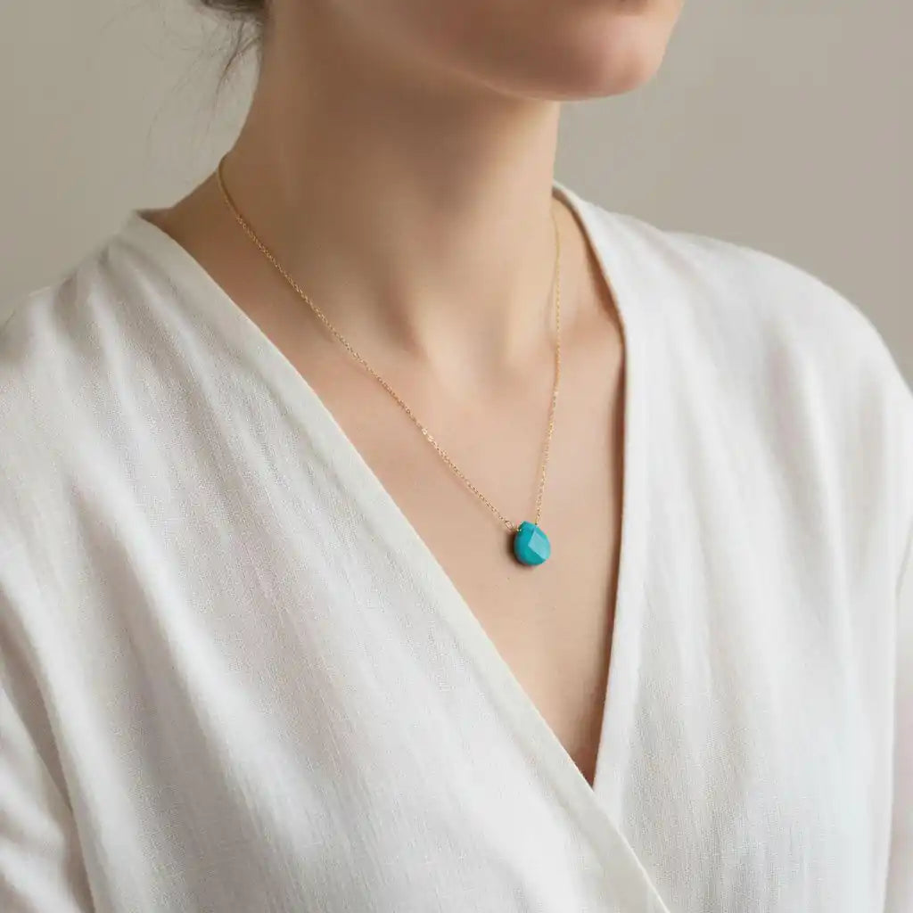 Gold Filled Aqua Jade Wire Wrap Gemstone Drop Necklace worn by a model, showcasing its elegant design and aqua jade drop.
