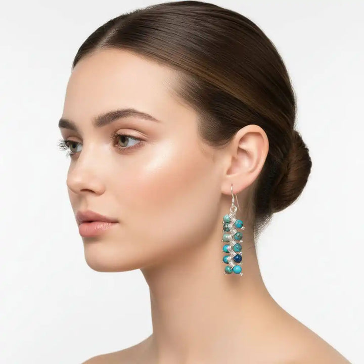 Seen On Jane The Virgin Silver Turquoise Wire Coil Earrings worn by a model showcasing bohemian elegance.