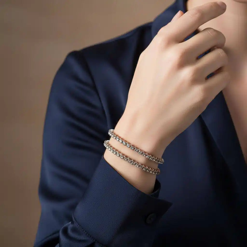 Woman wearing a Catch-Free Crystal Rhinestone Tennis Bracelet Bangle on her wrist with a navy blouse.