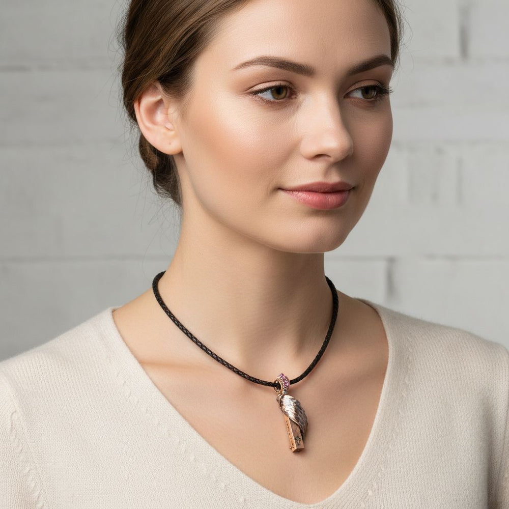 Sculpted Copper Angelwing Crystal Birthstone Necklace worn by a model, showcasing the copper wing and Swarovski crystal.