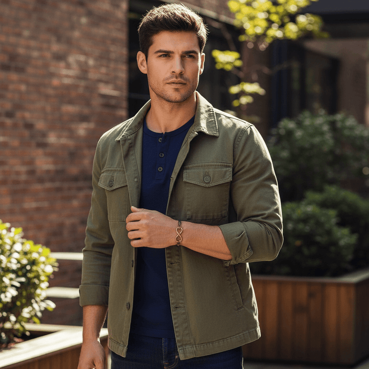 Male model wearing copper swivel infinity bracelet - outdoor setting