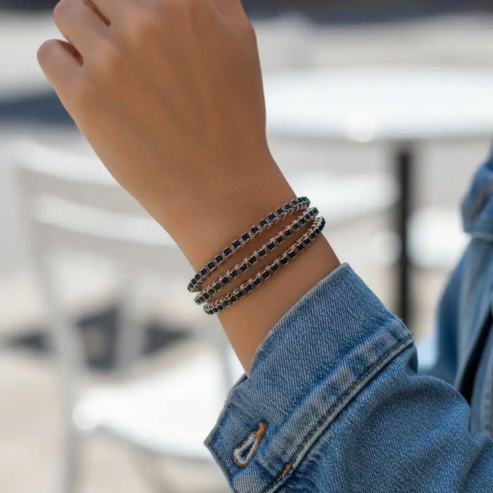 Wire Wrapped Copper Silver Black Crystal Rhinestone Bangle on a wrist, showcasing its stunning design and elegance.