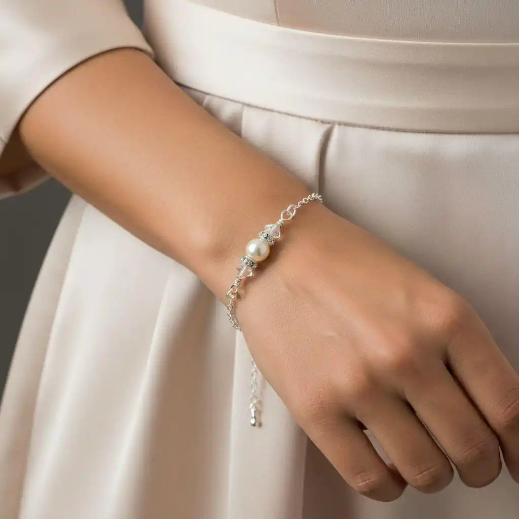 Silver Swarovski Crystal Pearl Bar Bridal Bracelet worn on a wrist, showcasing elegance and style for brides and special occasions.