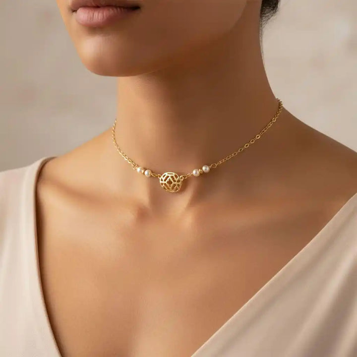 As Seen on Molly Ringwald Gold Filled Pearl Choker Necklace worn by model, featuring elegant gold chain and pearl details.
