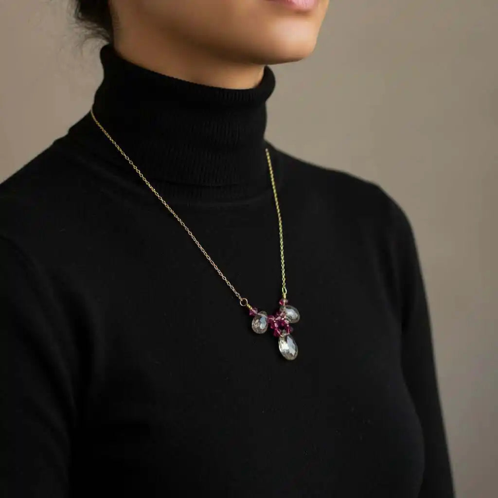 Adjustable Gold Filled Wire Wrapped Gemstone Necklace worn by model, featuring rainbow quartz briolette and fuchsia Swarovski crystals.