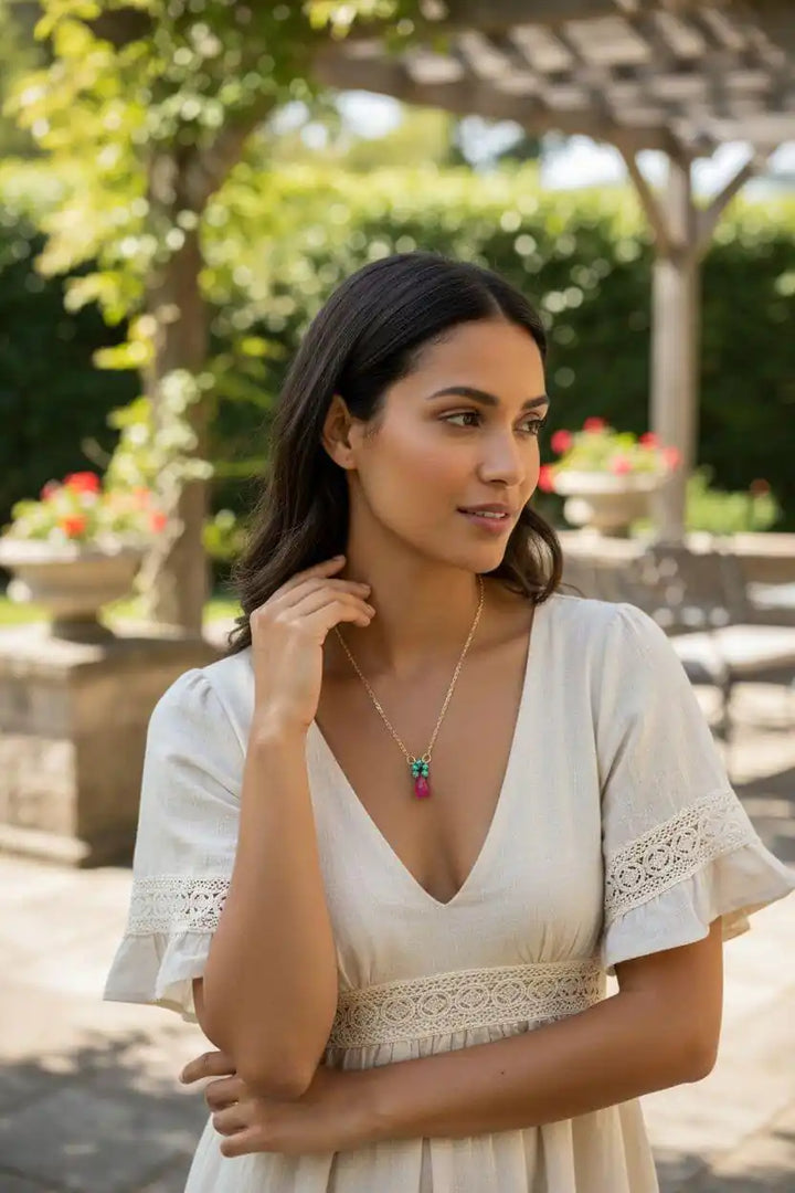 Gold Filled Pink and Aqua Gemstone Crystal Chain Necklace worn by a woman in a garden setting.