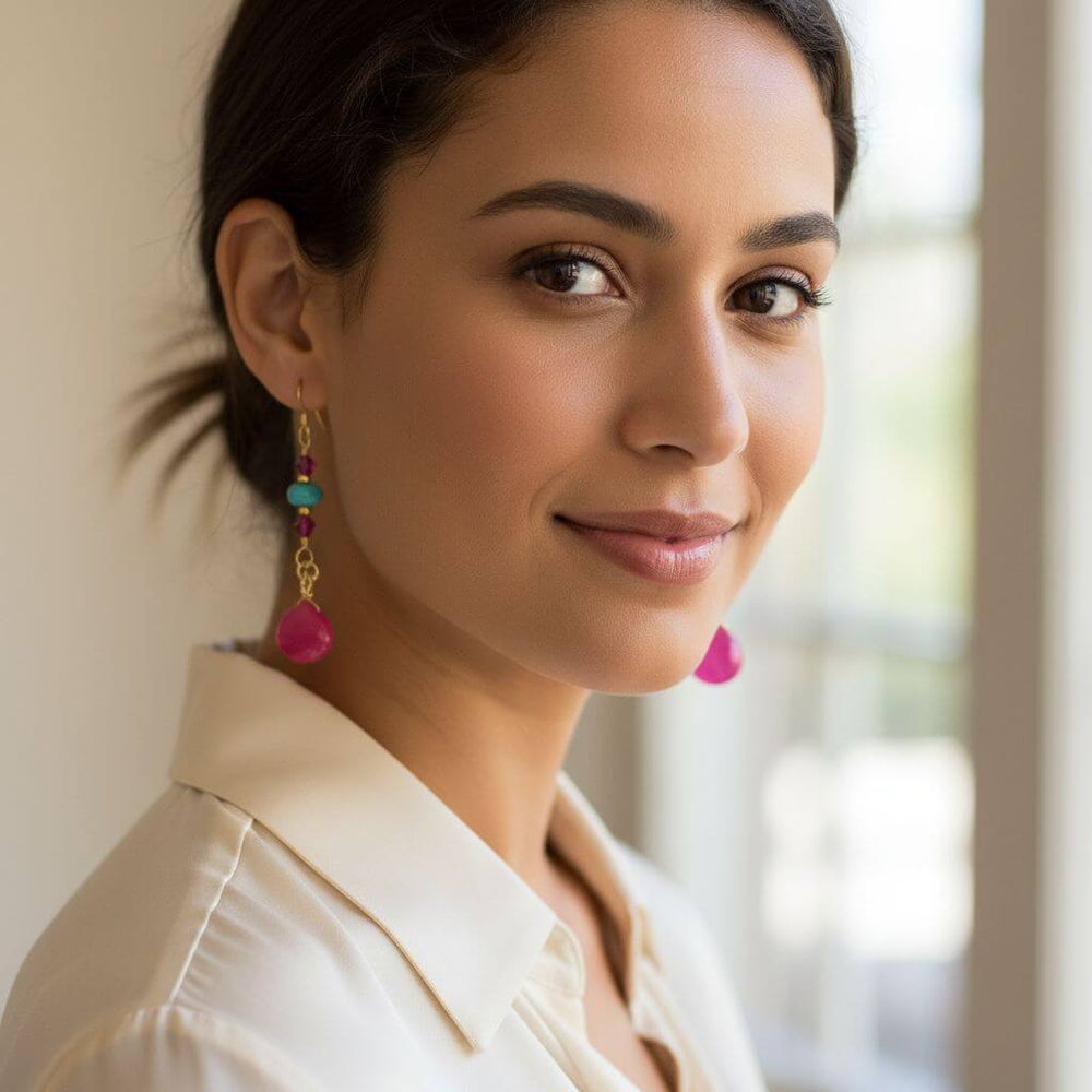 Gold Filled Wire Wrapped Pink Turquoise Gemstone Earrings worn by a model showcasing their vibrant design.