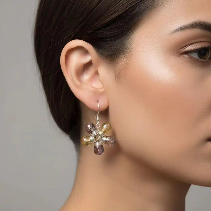 Purple and Yellow Flower Sterling Silver Earrings displayed on a model, showcasing their unique flower design.