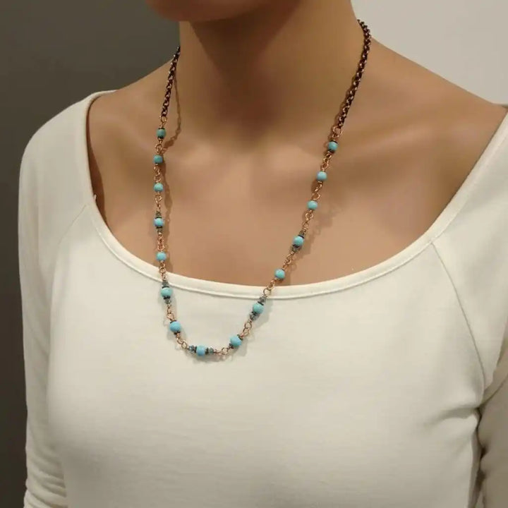 Wire Wrapped 24 Inches Copper Turquoise Necklace showcased on a model wearing a white top