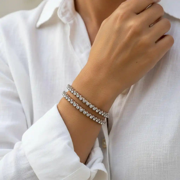 Catch-Free Crystal Rhinestone Tennis Bracelet Bangle worn on a hand with a white shirt, showcasing its stunning design.