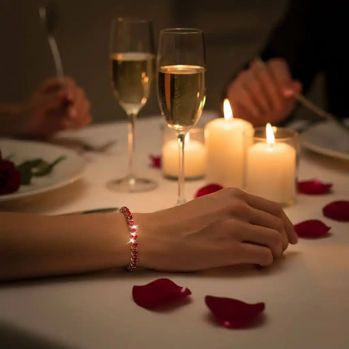Wire Wrapped Red Crystal Tennis Bracelet Bangle elegantly displayed on a table set for a romantic dinner.