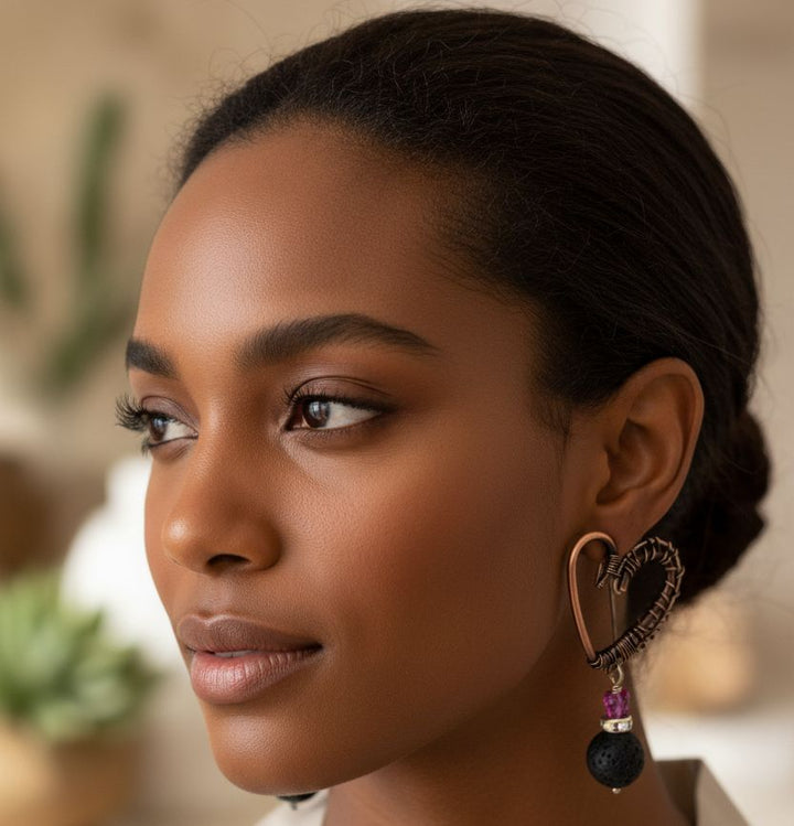 Copper Sculpted Heart Hoop Crystal Butterfly Lava Rock Earrings worn by a model showcasing unique artisan craftsmanship.