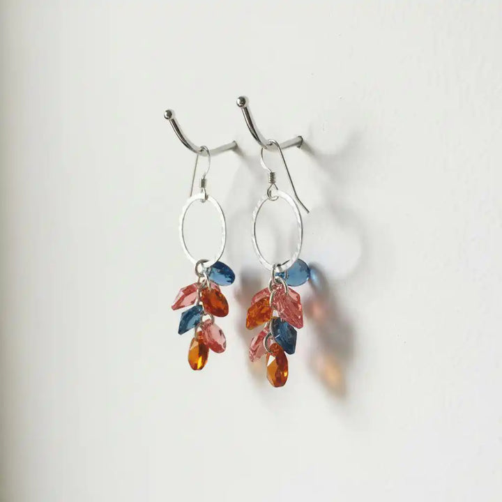 Silver Circle Multi Color Crystal Drop Dangle Earrings featuring vibrant Swarovski crystals in blue, orange, and pink.